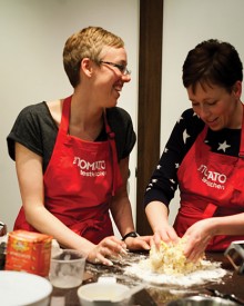 Nikki McGill and her sister Jodi share a laugh over pasta dough.