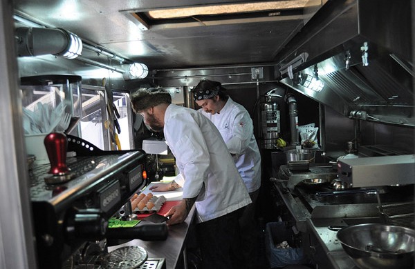 Omnivore Food Truck: Mark Bellows in fur hat, Ryan Brodziak in bandana.