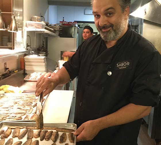 Sabor chef Lino Olivera preps sardines