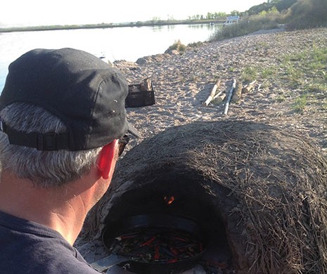 Blair Lebsack (RgeRd, pictured), Brayden Kozak, Alessandro Porcelli and videographer/outdoorsman Kevin Kossowan went to the island early to build the mud oven and the grills.
