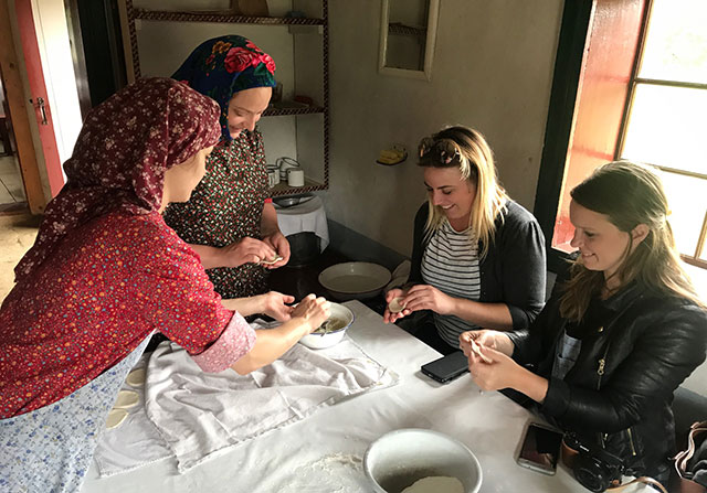 UK food and travel writers Emily Luxton (left) and Chloe Gunning get the skinny on pyrohy at a heritage food workshop. 