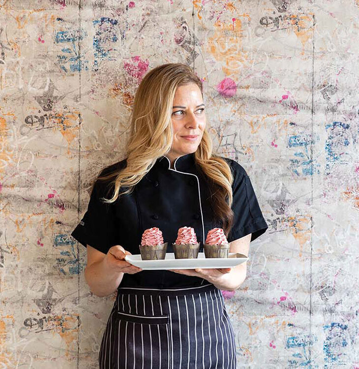 Food in the Nud owner Chrysta Morkeberg with the Chocolate Cherry Bomb cupcake.