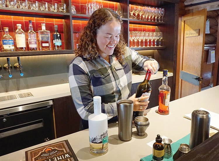 The multi-talented Maya Baylis mixes cocktails.